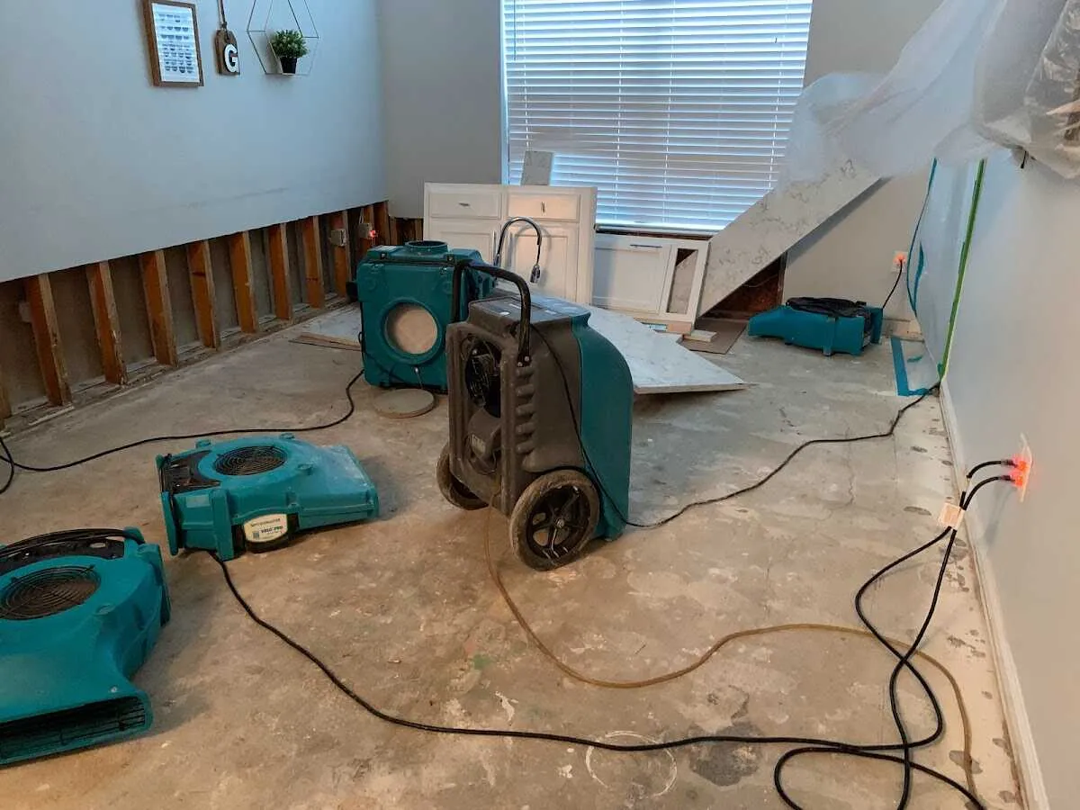 Dehumidifier in flood-cut room for Water Damage Restoration in Orchard Mesa